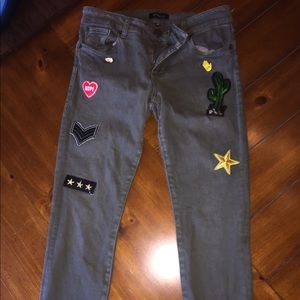 Military green jeans with patches